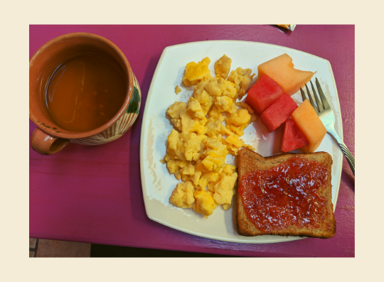 Eggs, fruit, toast, and tea at Hotel Trebol