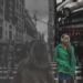 Altered photo highlighting a Black woman on a busy city street