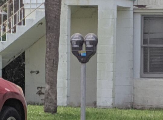 Parking meter in the grass 